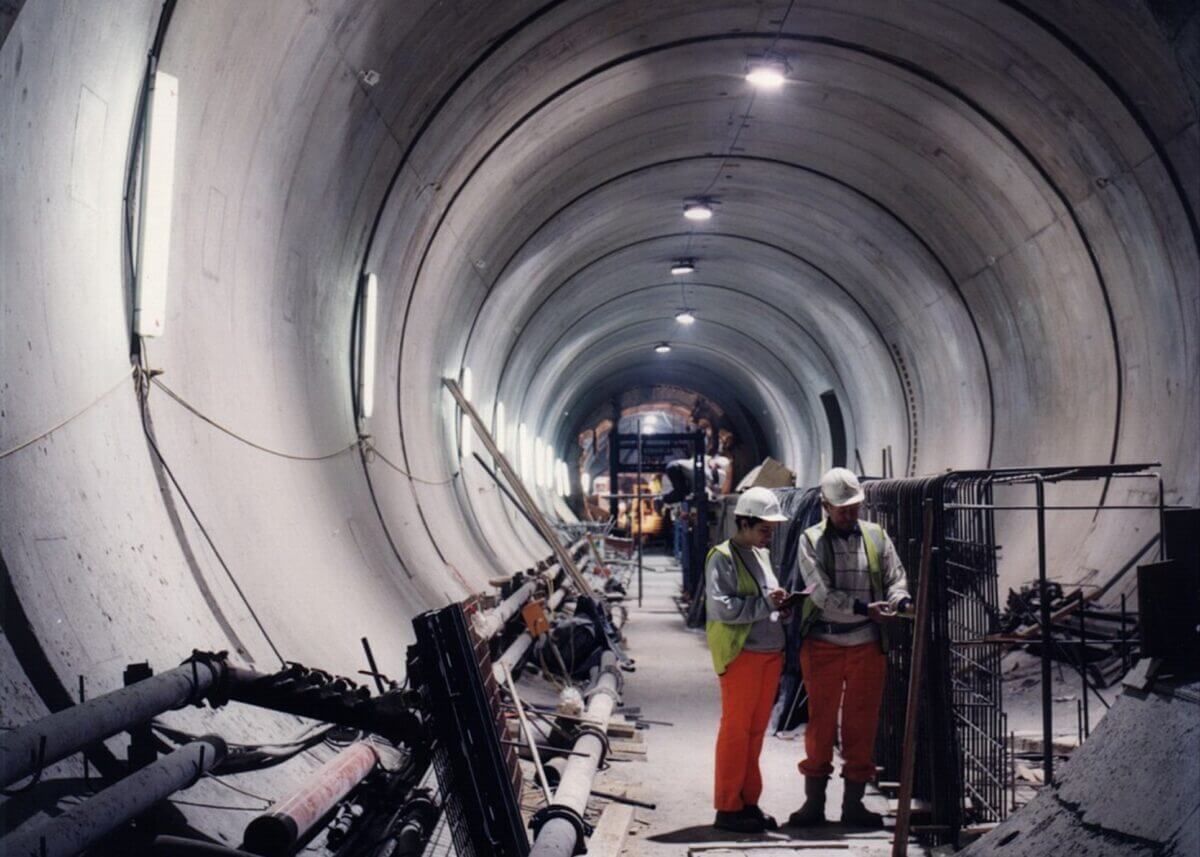 Engineers working in a large tunnel